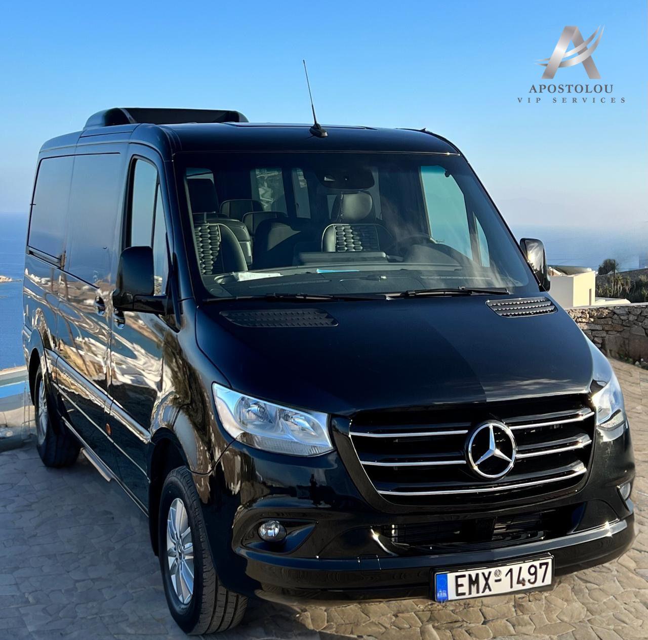Black Mercedes Sprinter VIP van above the Aegean on Mykonos