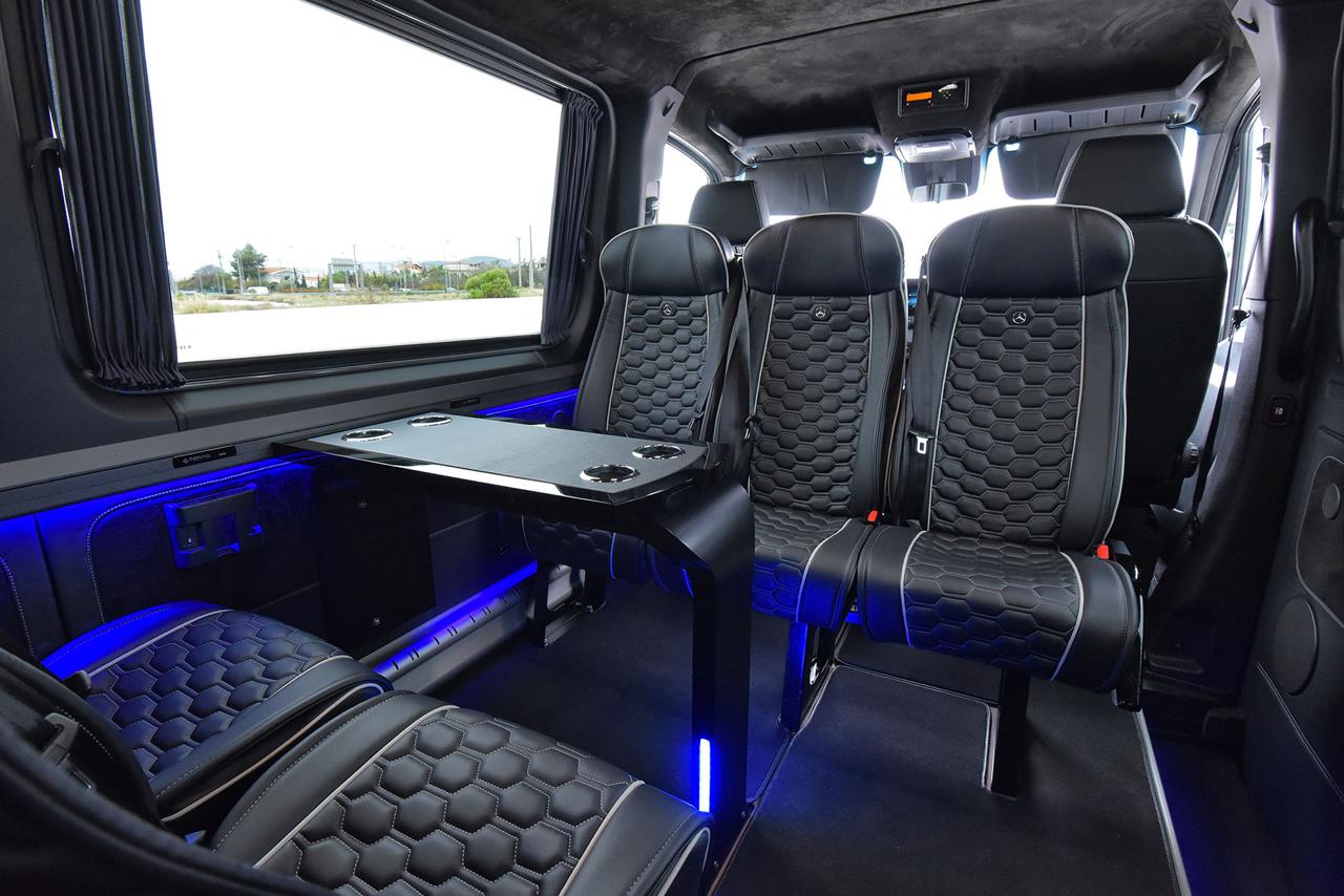Sprinter VIP cabin with quilted captain seats and blue ambient lighting